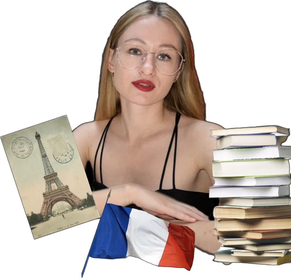 Аня в окулярах з книжками, прапором Франції та листівкою з Ейфелевою вежею